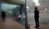 Bảo vệ khách sạn đuổi người trú mưa. Ảnh cắt từ clip