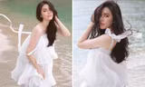 Lý Nhã Kỳ diện váy trắng mỏng manh khoe dáng quyến rũ trước biển 