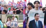 Đám đông cầm ảnh Chủ tịch Thượng viện Campuchia Hun Sen và Thủ tướng Hun Manet trong cuộc tuần hành ở Phnom Penh ngày 18/6. (Ảnh: Khmer Times)