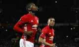 Pogba (trái) và Martial giúp Man Utd ghi ba bàn ngay trong hiệp một. Ảnh: Reuters.