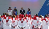 Tổng thống Vladimir Putin dự buổi xuất quân của đoàn thể thao Nga dự Olympic Sochi. Ảnh: AP