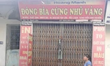Chiều 5/7, Cơ sở Photo vi tính Hoàng Mạnh (số 75, đường Bạch Liêu, TP Vinh) đang bị niêm phong, đóng cửa để phục vụ mở rộng điều tra. Ảnh: Đ.LAM
