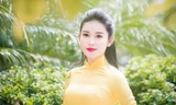 Á hậu Huyền My rạng rỡ áo dài vàng ghi hình Tết