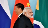 Chủ tịch Trung Quốc Tập Cận Bình và Thủ tướng Ấn Độ Narendra Modi tham dự buổi chụp ảnh nhóm trong Hội nghị thượng đỉnh BRICS tại Trung tâm Triển lãm và Hội nghị Quốc tế Hạ Môn ở Hạ Môn, Phúc Kiến ngày 4/9/2017