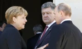 Từ trái qu phải: Thủ tướng Đức Angela Merkel, Tổng thống Ukraine Petro Poroshenko, Tổng thống Nga Vladimir Putin