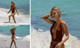 Chân dài 9x Joy Corrigan cực nóng bỏng ở biển với áo tắm xẻ sâu hút mắt