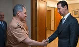 Bộ trưởng Quốc phòng Nga Sergei Shoigu và Tổng thống Syria Bashar al-Assad. (Nguồn: RT)