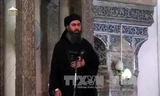 Thủ lĩnh IS Abu Bakr al-Baghdadi phát biểu trước các tín đồ trong lễ cầu nguyện tại nhà thờ Hồi giáo ở Mosul, Iraq ngày 5/7/2014. Ảnh: AFP/TTXVN.
