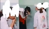 Nữ sinh Y. ôm mặt sau khi bị đánh hội đồng. Ảnh cắt từ clip