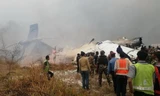 Hiện trường vụ máy bay bốc cháy ở Nepal ngày 12/3. Nguồn: The Sun/TTXVN.