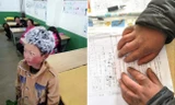 Mái tóc đóng băng trắng xóa và bàn tay nứt nẻ, đỏ ửng của một học sinh lớp 3 ở Trung Quốc sau khi đi bộ tới trường trong cái rét kỷ lục.