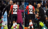 HLV Pep Guardiola có vẻ muốn khiêu khích Nathan Redmond.