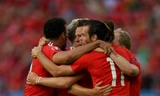 Niềm vui của các cầu thủ xứ Wales sau khi giành vé vào tứ kết.