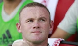 Wayne Rooney trên đường trở lại nước Anh.