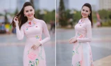 Hoa hậu biển Thùy Trang dịu dàng trong tà áo dài nền nã