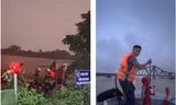 [CLIP] Cảnh sát cứu 3 người dân mắc kẹt ở bãi giữa sông Hồng