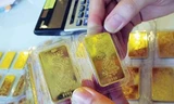 Vàng, USD chững lại sau tuyên bố của Ngân hàng Nhà nước