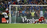 Buffon chặn đứng quả đá 11m của Muller tại tứ kết Euro 2016. Ảnh: Reuters