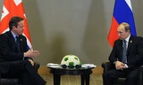 Thủ tướng Anh David Cameron và Tổng thống Nga Vladimir Putin hội đàm tại G20. Ảnh: RT