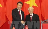 Tổng Bí thư Nguyễn Phú Trọng và Tổng Bí thư, Chủ tịch Trung Quốc Tập Cận Bình tại Lễ ký kết các văn kiện hợp tác giữa hai nước. (Ảnh: Trí Dũng/TTXVN)