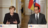 Thủ tướng Đức Angela Merkel (trái) và Tổng thống Pháp Francois Hollande. ảnh: Reuters.