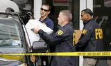 FBI thu giữ các tài liệu liên quan hôm 3/12. Ảnh: Reuters.