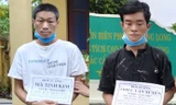 Đối tượng Mã Tinh Kim (trái) và Triệu Văn Xuyên (phải) bị bắt giữ khi đưa người qua biên giới Trung- Việt bất hợp pháp .Ảnh: TL