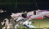 Một phần máy bay được trục vớt. Ảnh: Channel News Asia