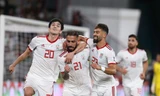 Các cầu thủ Iran ăn mừng trước Oman