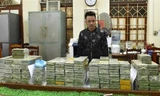 Truy tố 12 bị can mua bán trái phép gần 500 bánh heroin