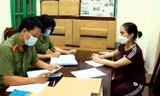 Đối tượng Hoàng Thị Thanh Nga làm việc với cơ quan công an
