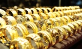 Vàng giảm, tỷ giá tiếp tục 'dậy sóng'
