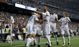 Real chia vui sau bàn mở tỷ số của Asensio. Ảnh: Reuters