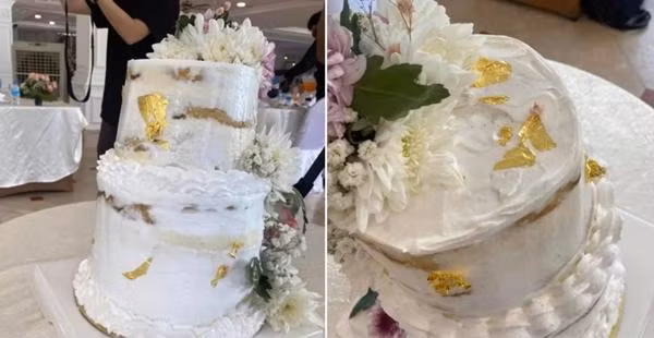 Bánh cưới thật được đem đến tiệc cưới. Ảnh: Facebook.