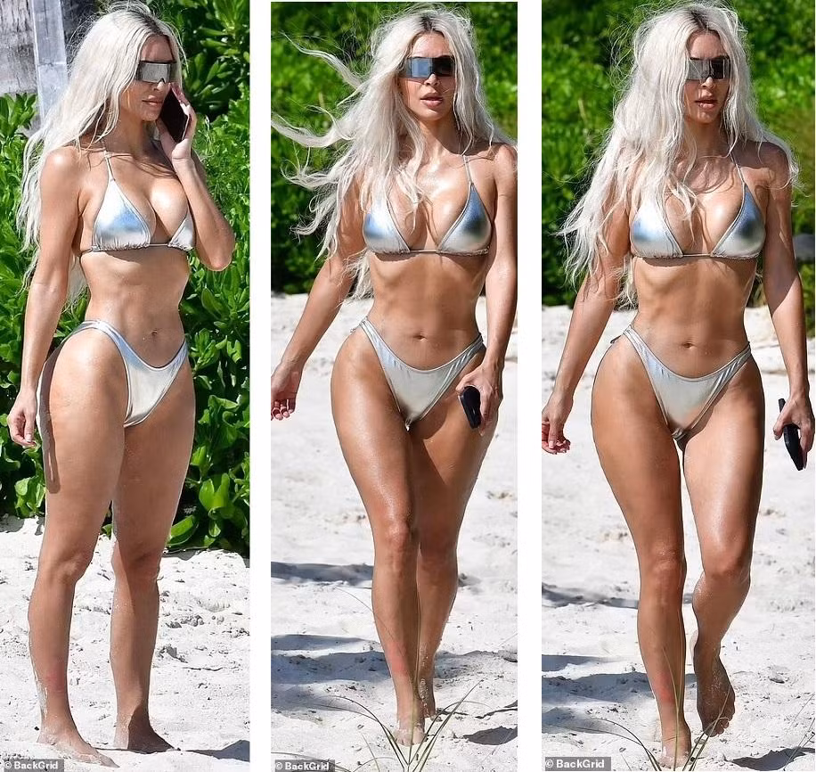 Kim Kardashian mặc bikini màu bạc tôn thân hình "đồng hồ cát" nóng bỏng. Mái tóc bạc và kính râm thời trang mang đến cảm giác Kim như một nhân vật trong phim khoa học viễn tưởng