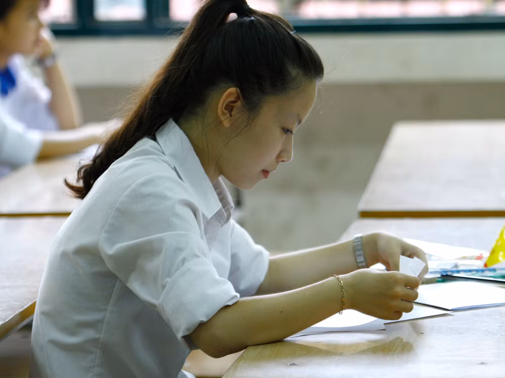 Thí sinh làm bài thi Địa lí sáng 9/7. Ảnh: Như Ý