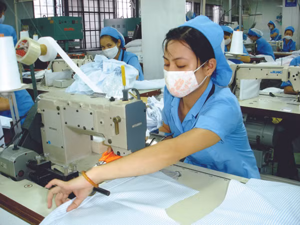 Dệt may là ngành có mức thưởng bình quân khá cao so với năm ngoái. Ảnh: Đại Dương