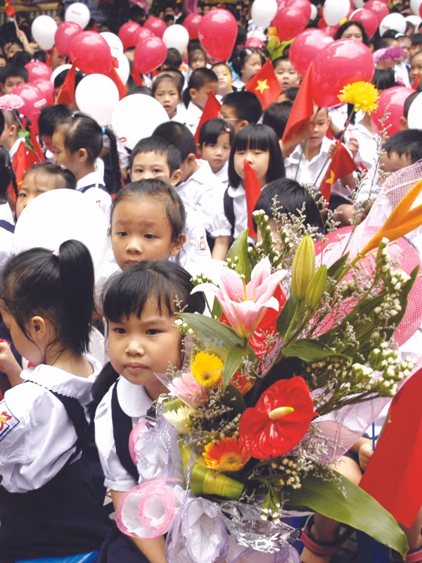Trẻ nhỏ ở Hà Nội trong ngày đầu tiên vào lớp 1.	Ảnh: Phạm Yên
