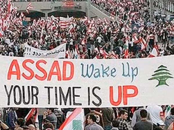Biểu tình chống chính phủ ở Syria (Ông Assad hãy tỉnh ngủ, hết giờ rồi!).Ảnh: Getty Images