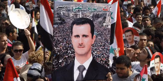 Biểu tình ủng hộ ông Assad trong chiến dịch chống lại biểu tình của phe đối lập. Ảnh: Reuters