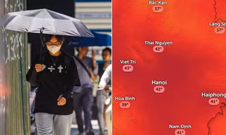 Người dân che nắng khi ra đường ở Hà Nội