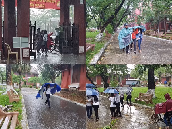 Huế: Phụ huynh đưa con đi làm thủ tục thi trong lốc lớn, mưa dữ dội